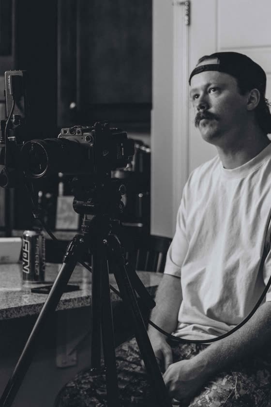 Portrait of a shop owner captured between takes